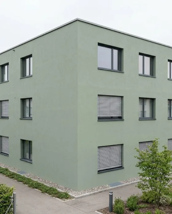Visualisierung: Modernes Wohnhaus mit Fassade in gedämpftem Salbeigrün